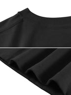 Close-up view of the collar and sleeve details of an Anti-Dillpressants Pickleball Tee in black fabric.